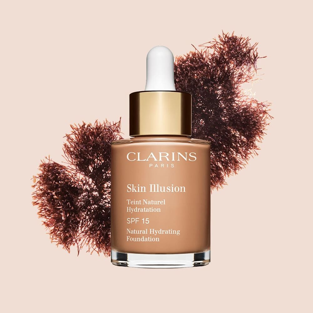 A base semelhante a s&eacute;rum Skin Illusion Clarins, com SPF 15, proporciona um resultado de base uniforme e natural.