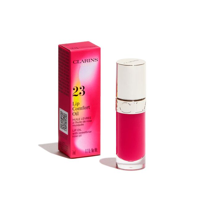 Imagem do produto Clarins Lip Comfort Oil cor-de-rosa da linha Power of Colors, apresentado ao lado da respetiva embalagem