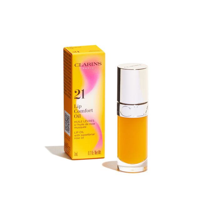 Imagem do produto Clarins Lip Comfort Oil amarelo da linha Power of Colors, apresentado ao lado da respetiva embalagem